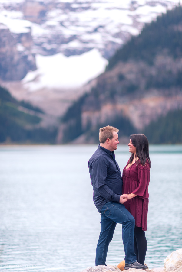 Lake Louise Engagement Photos infront of lake