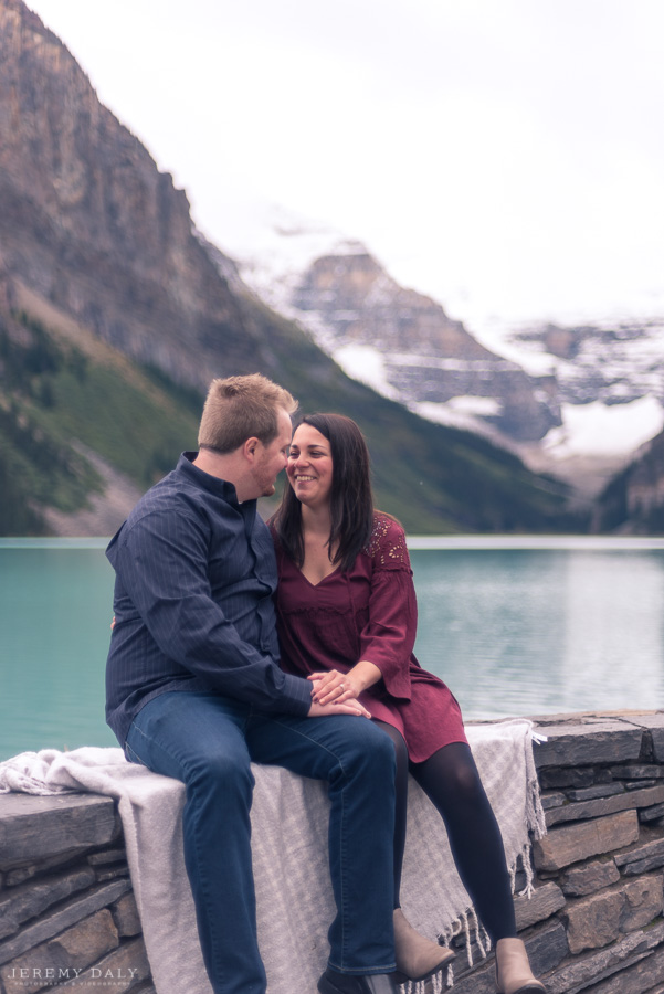 Lake Louise Engagement Photos infront of lake