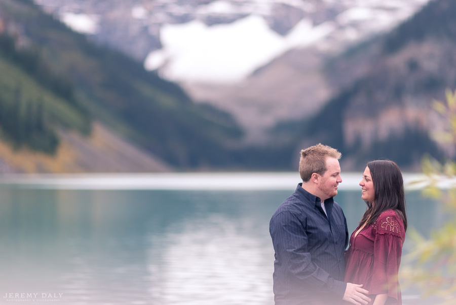 Lake Louise Engagement Photos infront of lake