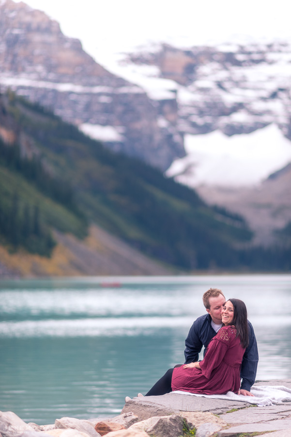 Lake Louise Engagement Photos infront of lake