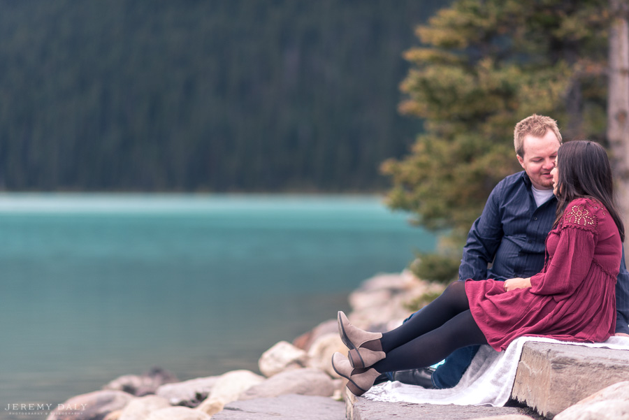 Lake Louise Engagement Photos infront of lake